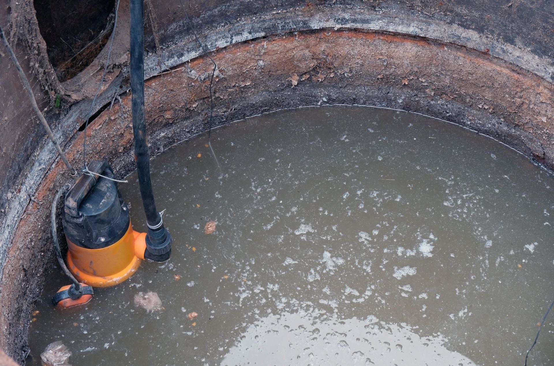 submersible pump emptying a cesspool on Oʻahu