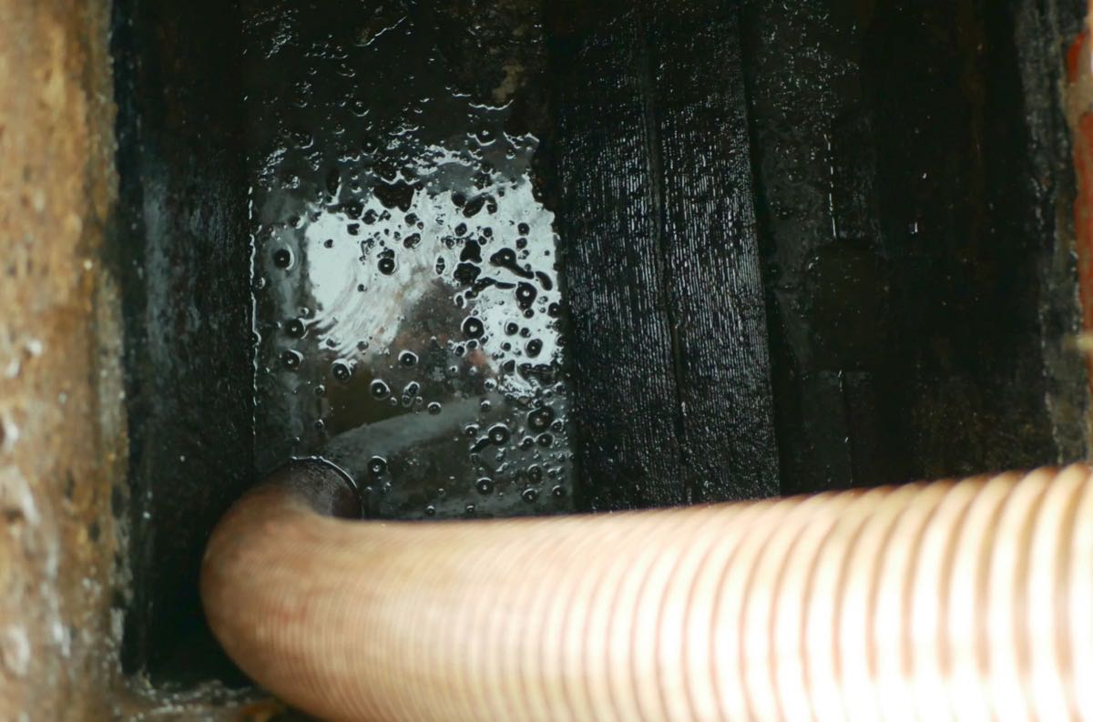 cesspool pumping hose at a Honolulu property
